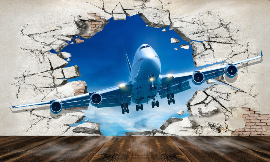Flugzeug kommt durch ein Loch in der Wand