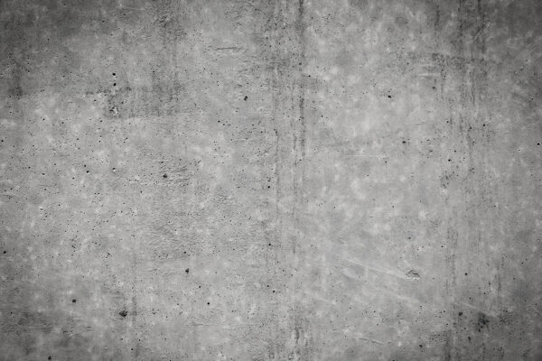 Graue Betonwand mit schwarzen Flecken Graue Betonwand mit schwarzen Flecken