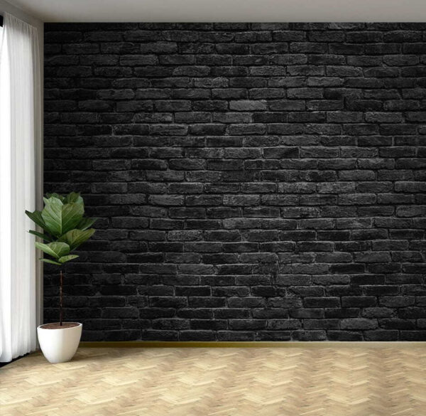 Schwarze Backsteinmauer mit einem weißen Fleck Schwarze Backsteinmauer mit einem weißen Fleck
