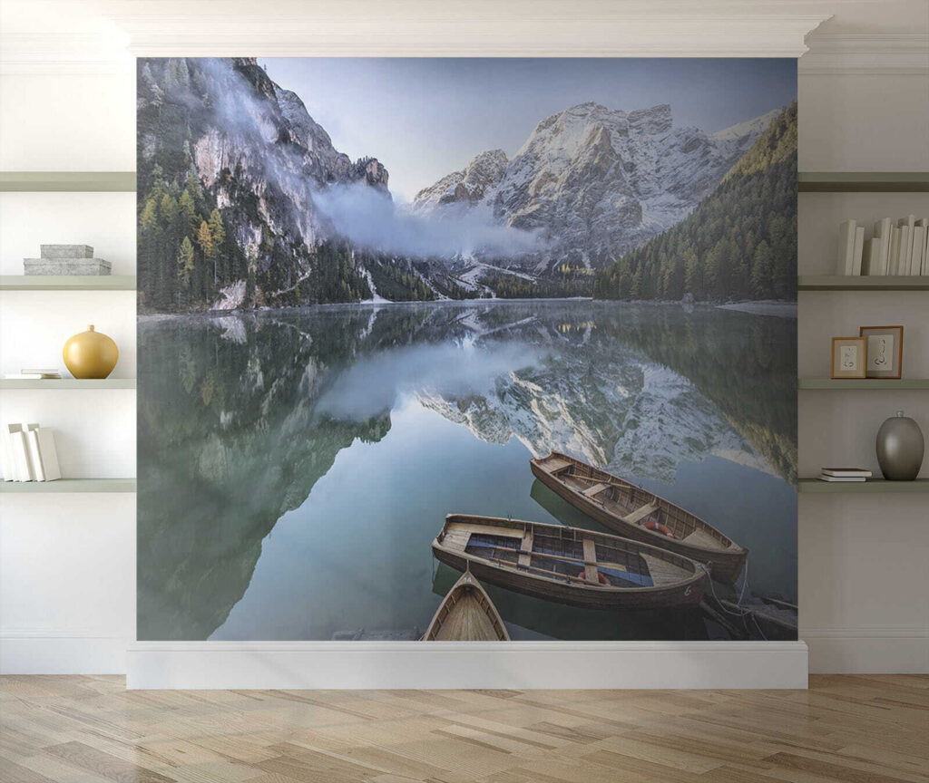 Boats on a lake with mountains in the background
