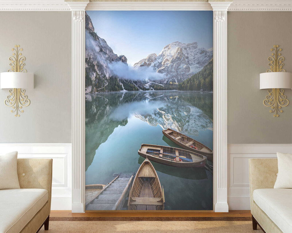 Boats on a lake with mountains in the background