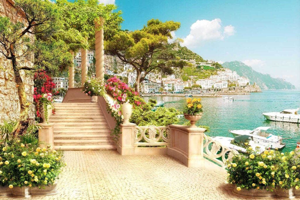 Steintreppe mit Blumen und Bäumen auf der Seite des Wassers Steintreppe mit Blumen und Bäumen auf der Seite des Wassers