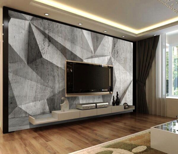 Eine Betonwand mit dreieckigem Muster Eine Betonwand mit dreieckigem Muster