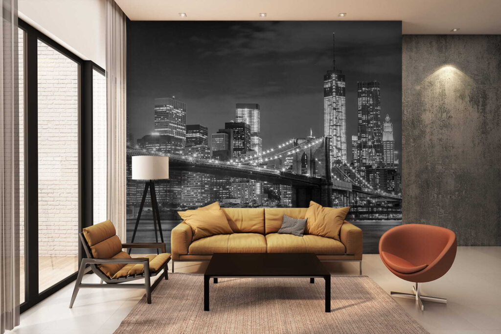 Bridge over water with city skyline at night