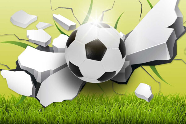 Fußball, der eine Wand durchbricht Fußball, der eine Wand durchbricht