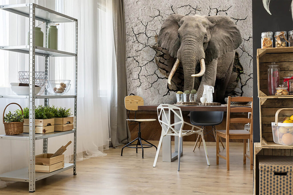 An elephant coming through a wall
