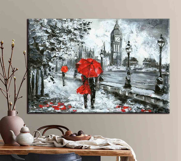 Ein Gemälde eines Paares mit Regenschirmen in einer verschneiten Stadt Ein Gemälde eines Paares mit Regenschirmen in einer verschneiten Stadt