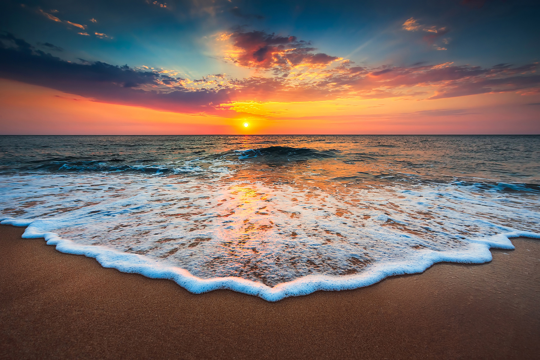 A sunset over a beach