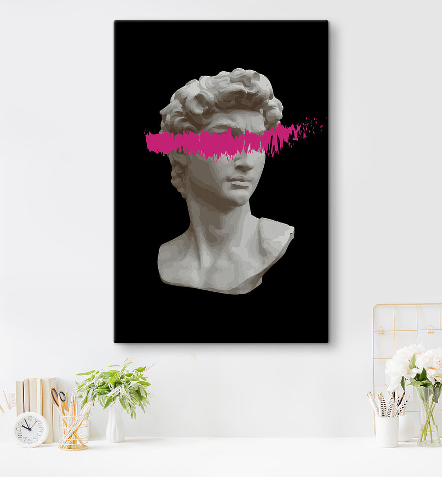 Eine Statue eines Mannes mit einer rosa Linie Eine Statue eines Mannes mit einer rosa Linie