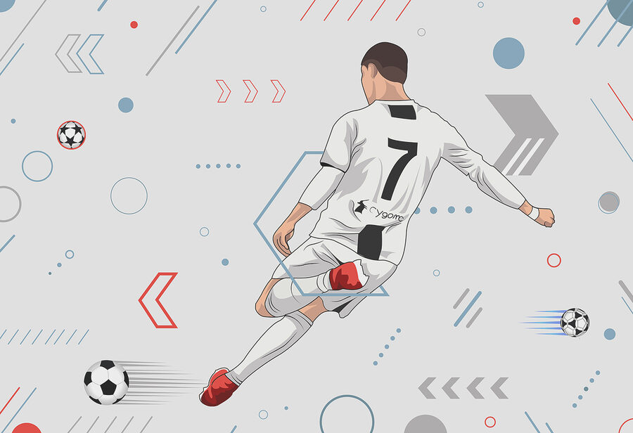 Ein Fußballspieler, der einen Ball schießt Ein Fußballspieler, der einen Ball schießt