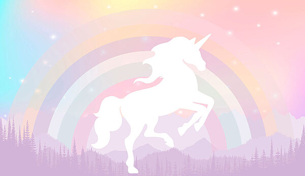 A unicorn with a rainbow and mountains