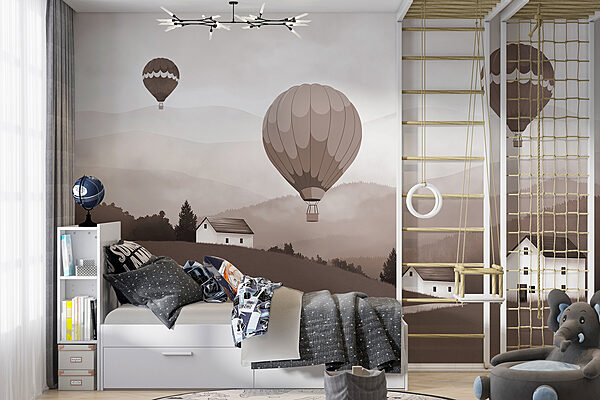 Group of hot air balloons flying over a village