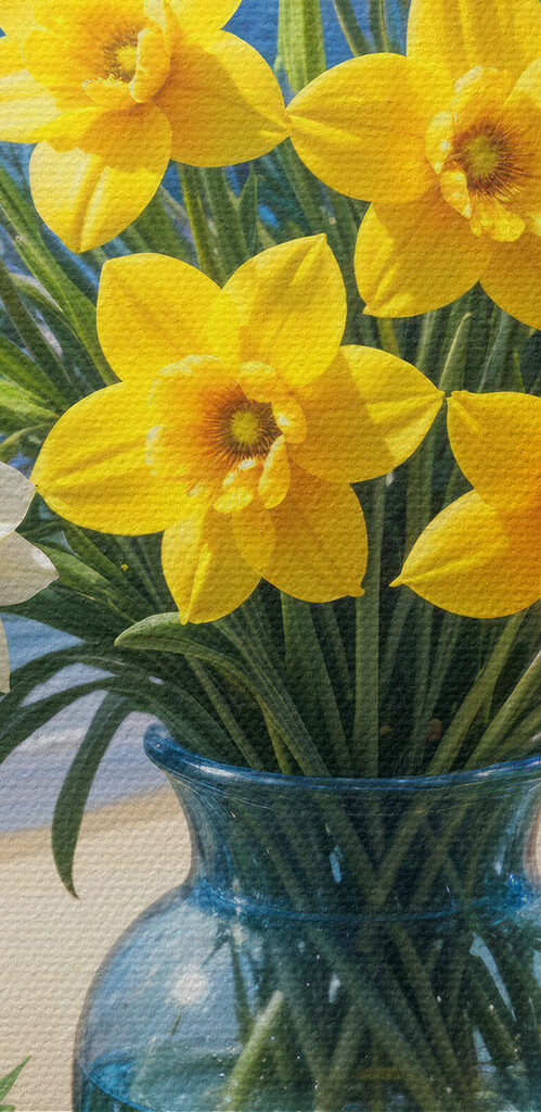 Vase of yellow and white flowers on a window sill