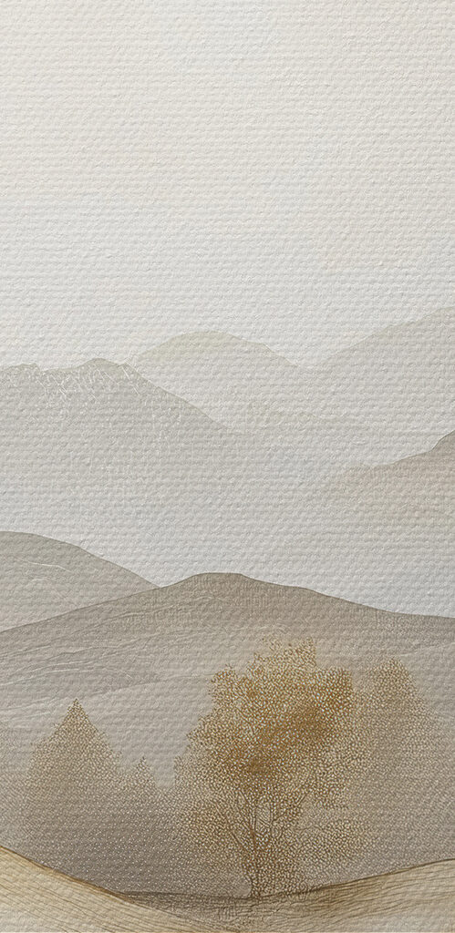 Landscape of hills with trees and mountains in the background