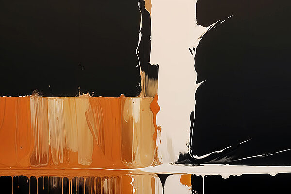 Weiße und orange Farbe tropft auf eine schwarze Oberfläche Weiße und orange Farbe tropft auf eine schwarze Oberfläche