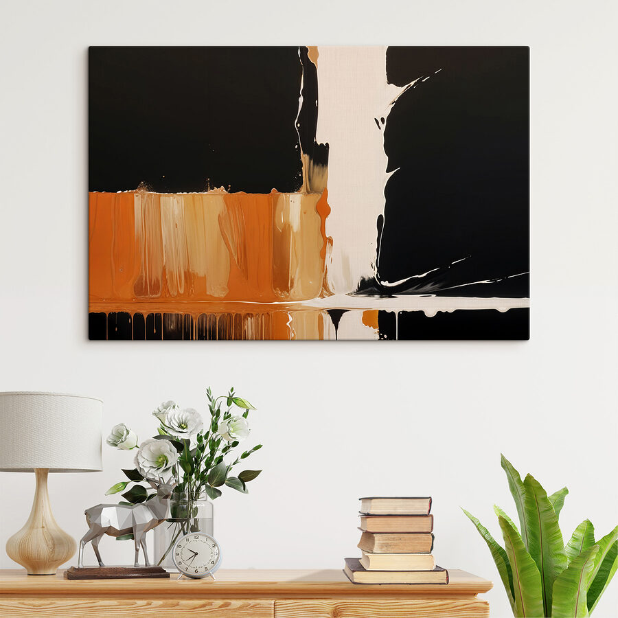 Weiße und orange Farbe tropft auf eine schwarze Oberfläche