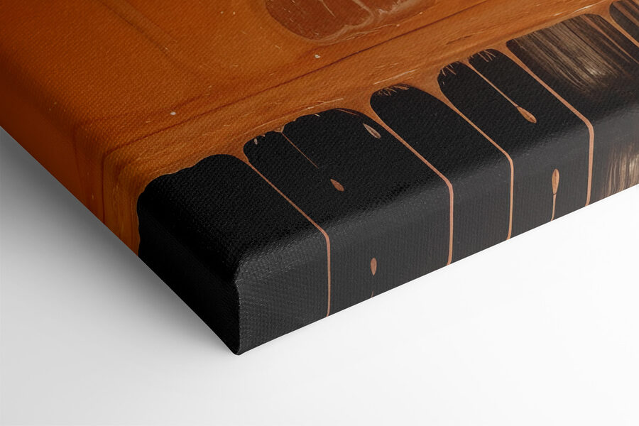 Weiße und orange Farbe tropft auf eine schwarze Oberfläche