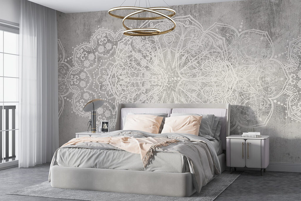 White ornate design on a grey surface