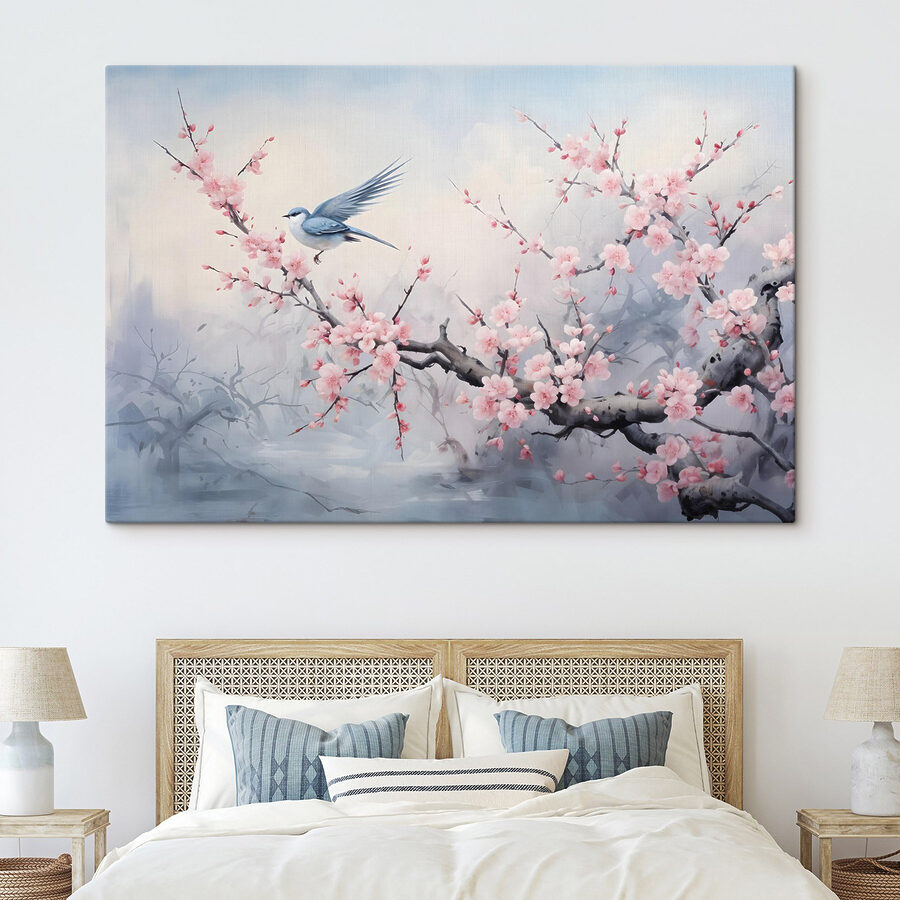 Vogel auf einem Zweig mit rosa Blüten