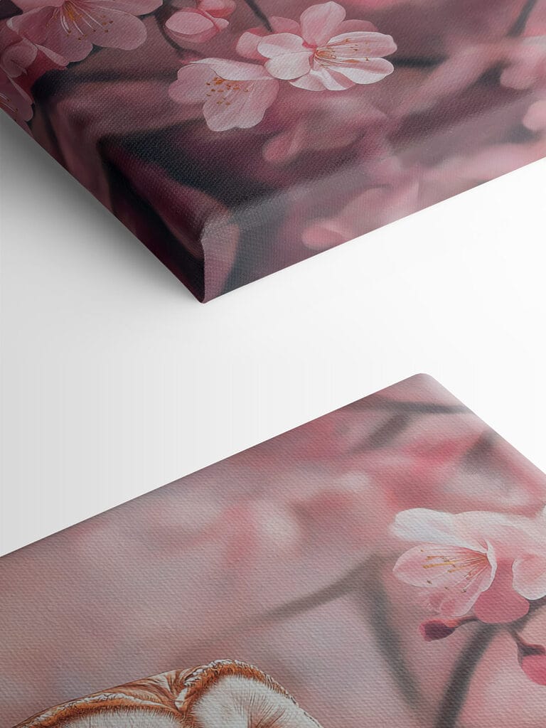 Owl sitting on a branch with pink flowers