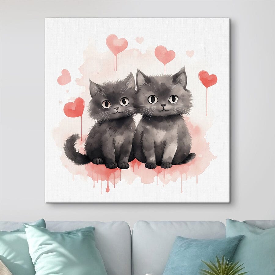 Zwei Katzen sitzen nebeneinander