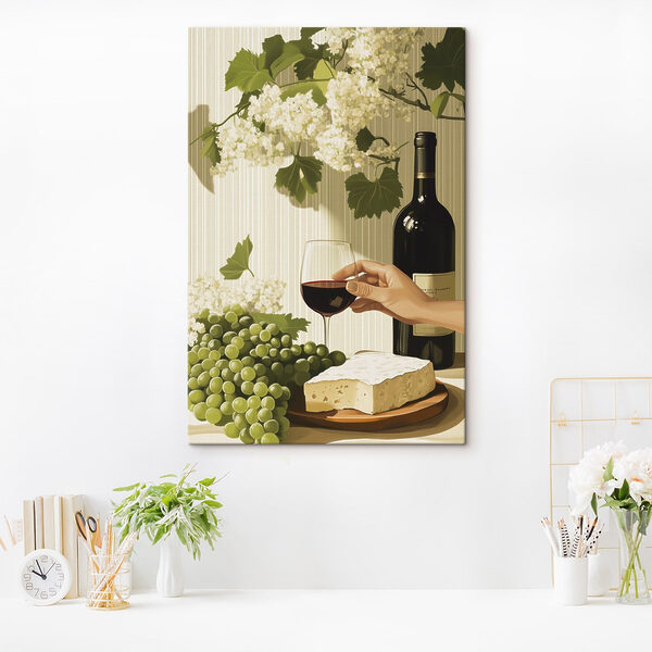 Eine Hand hält ein Glas Wein neben einer Flasche Wein Eine Hand hält ein Glas Wein neben einer Flasche Wein