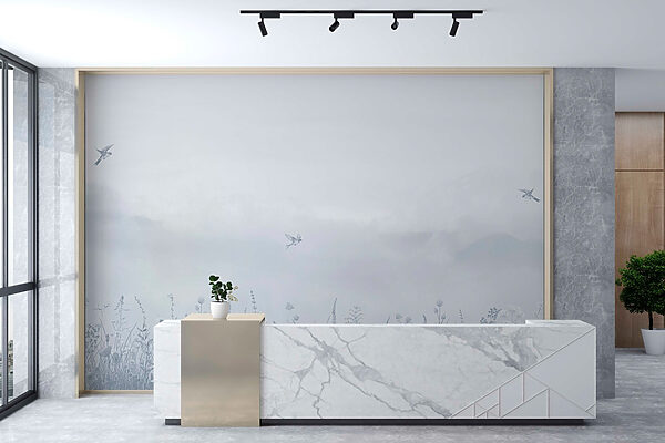 Bird flying over a field of flowers