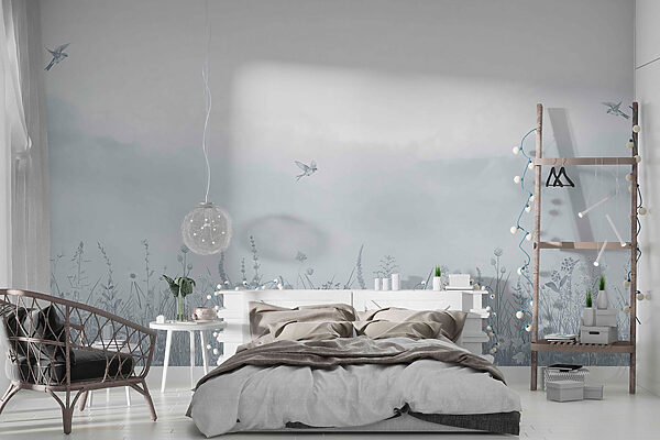 Bird flying over a field of flowers