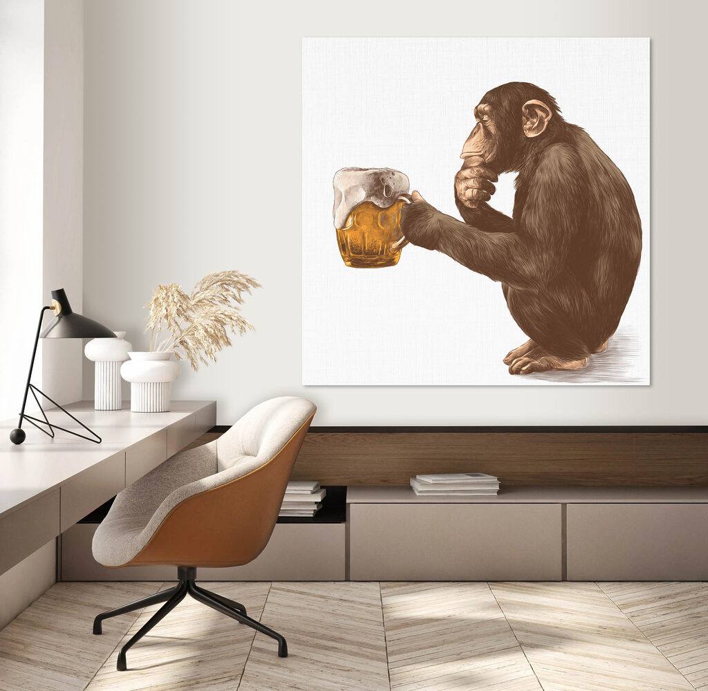 Monkey holding a mug of beer