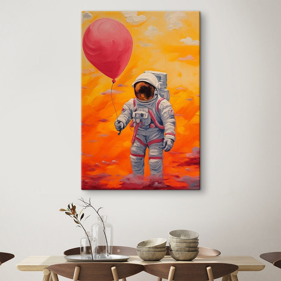 Wandbilder Ein Astronaut hält einen Ballon