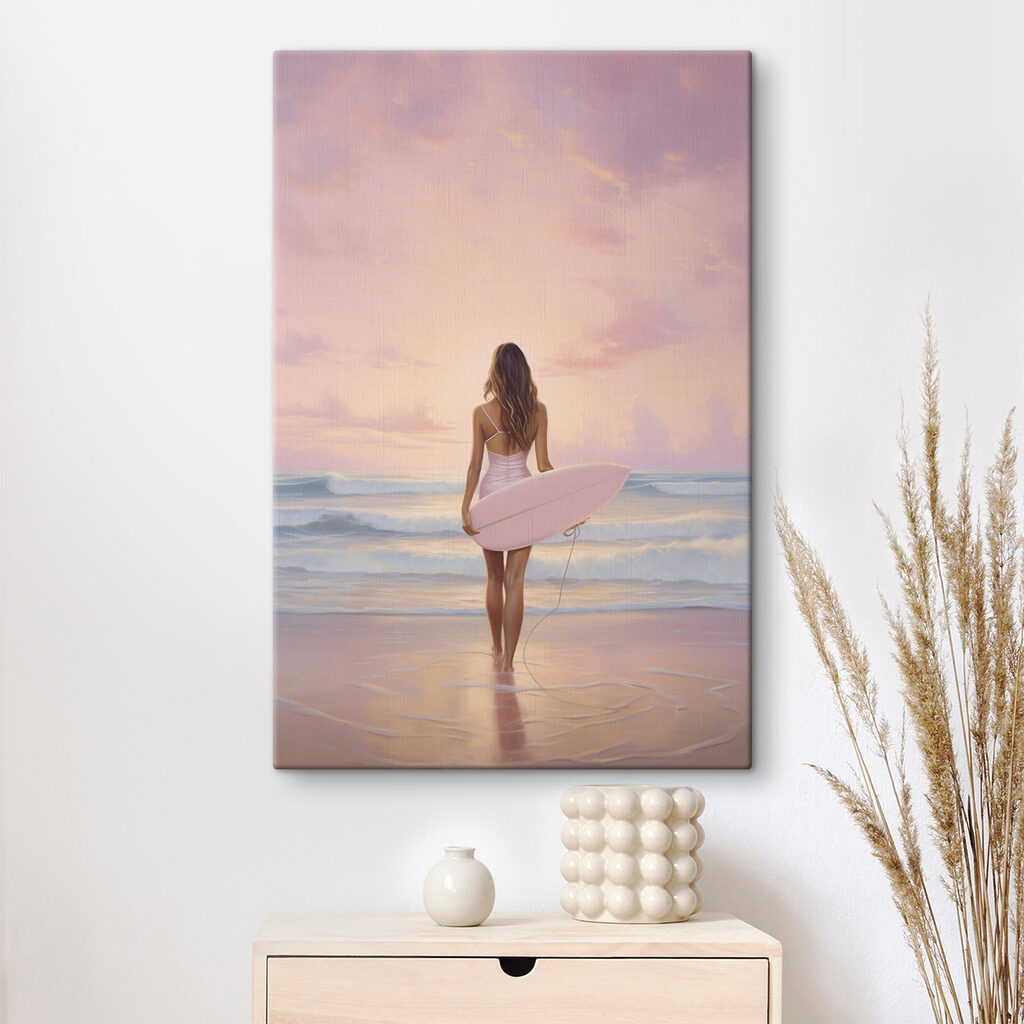 Woman in a swimsuit holding a surfboard on a beach