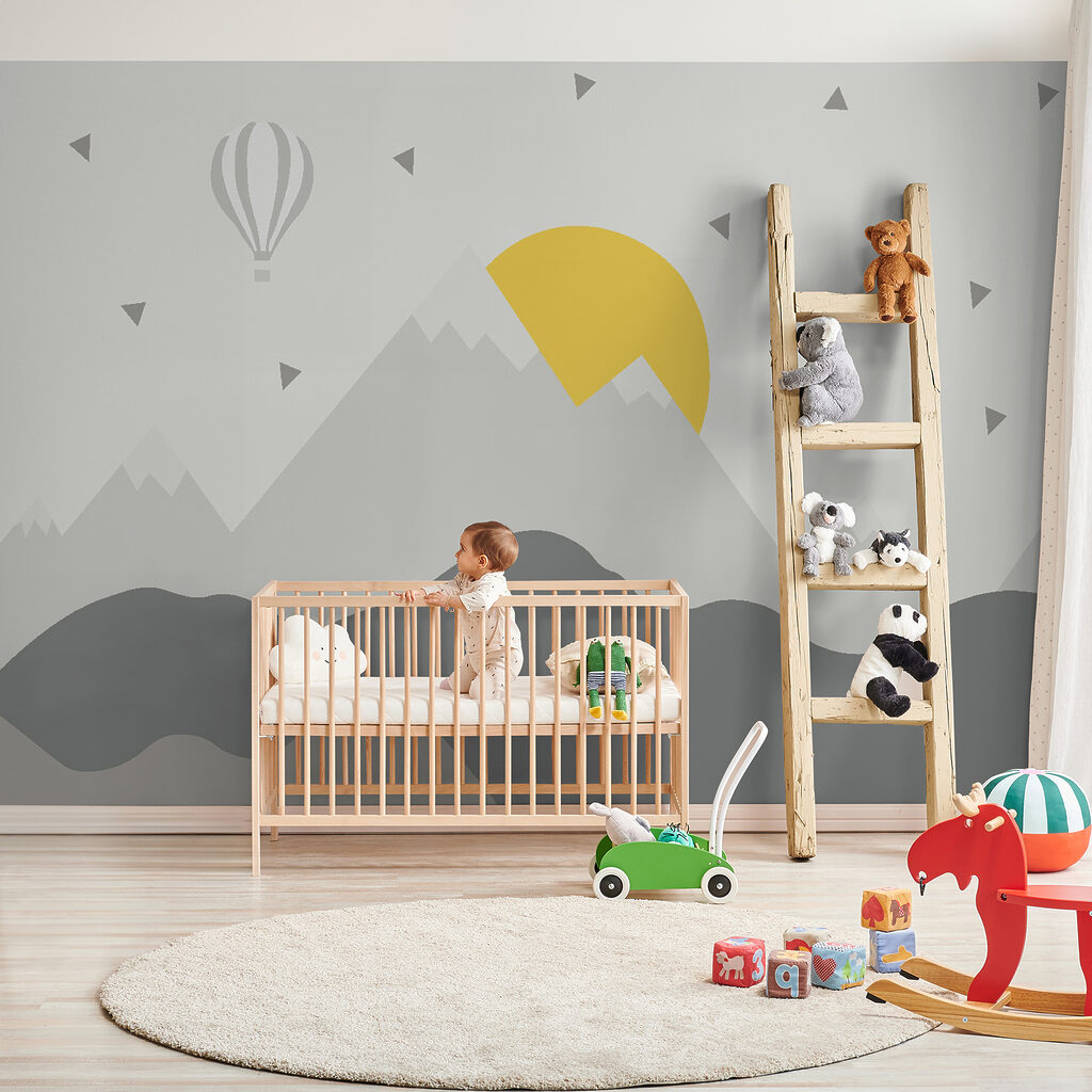 Mountain landscape with a hot air balloon and a sun