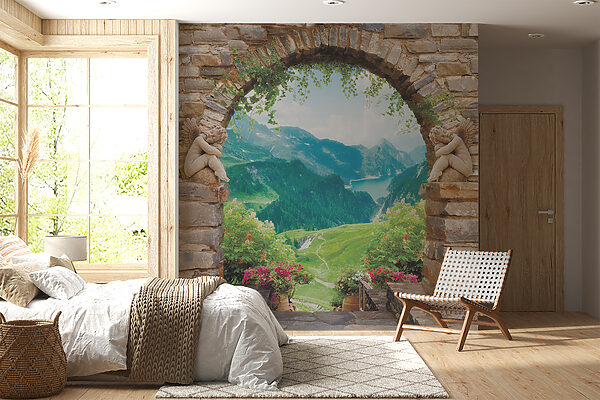 Steinbogen mit Steinstatuen und Blick auf ein Tal und Berge Steinbogen mit Steinstatuen und Blick auf ein Tal und Berge