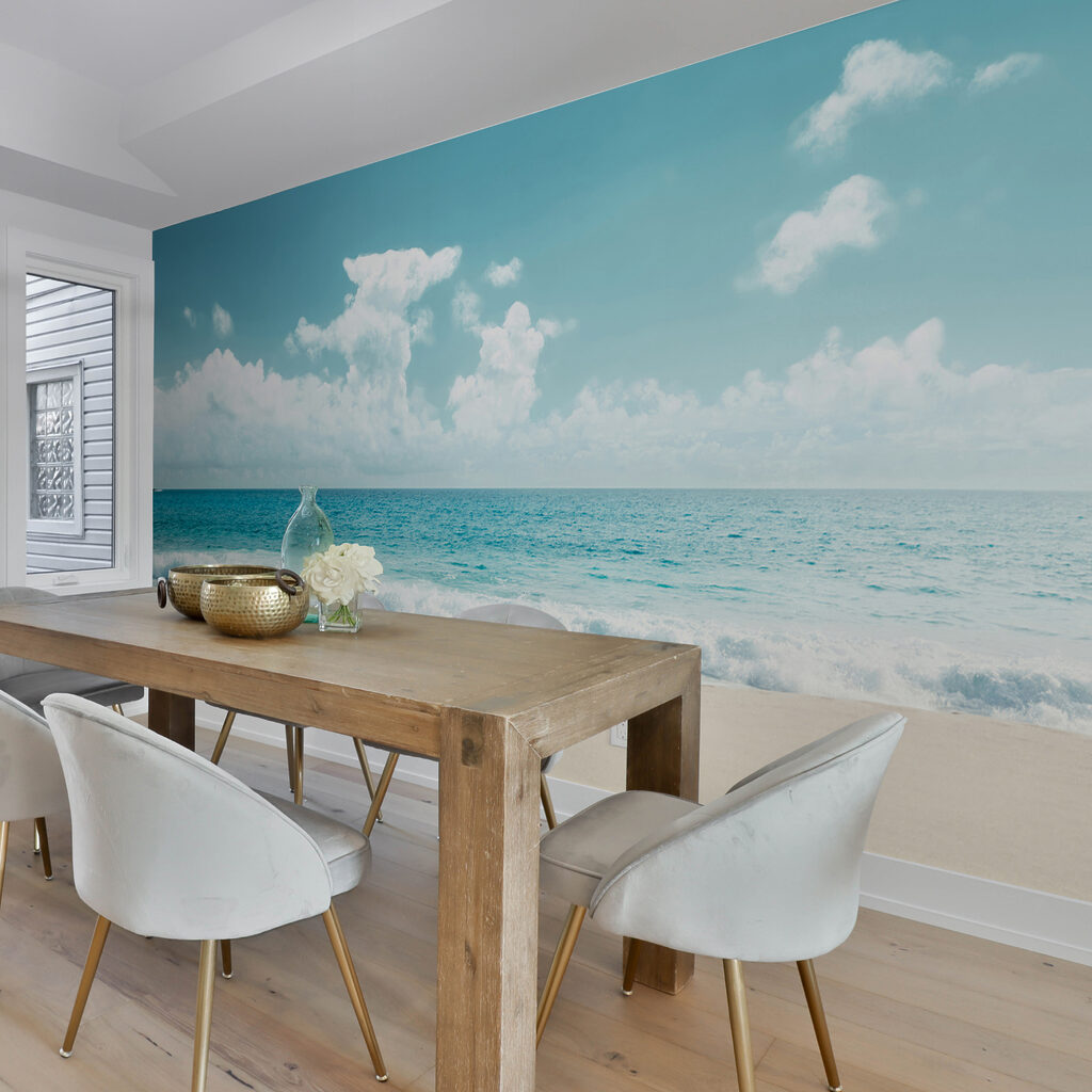 A beach with waves crashing on the sand