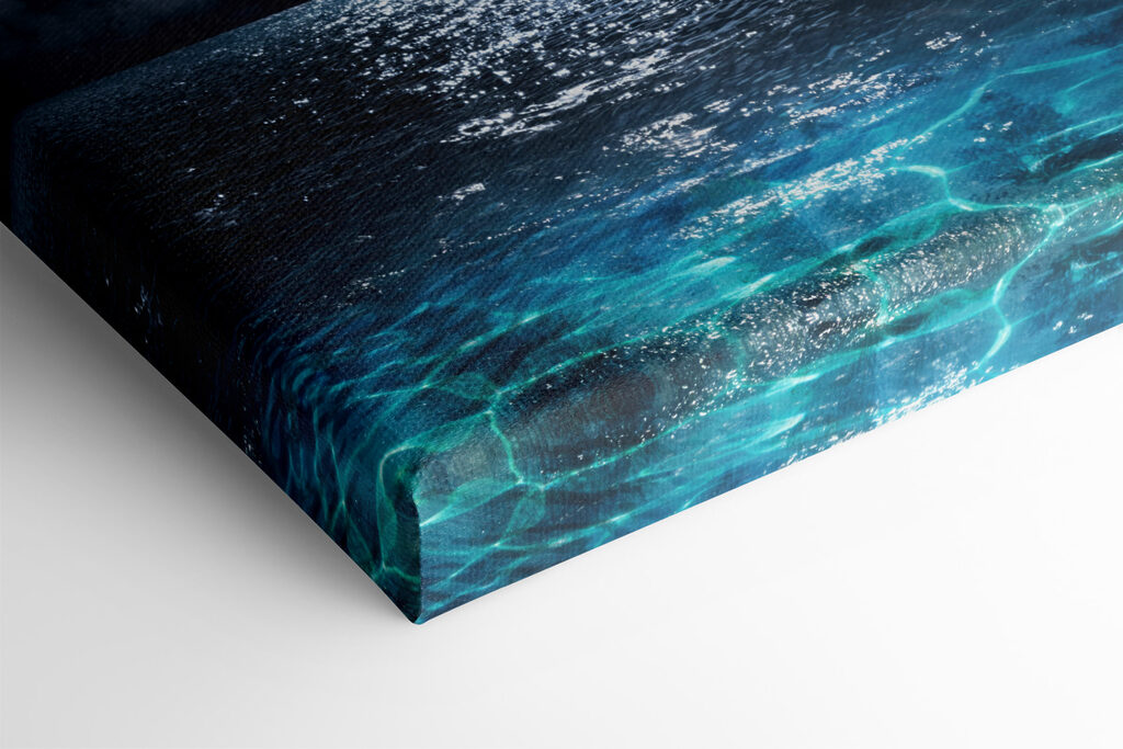 A moon over water at night