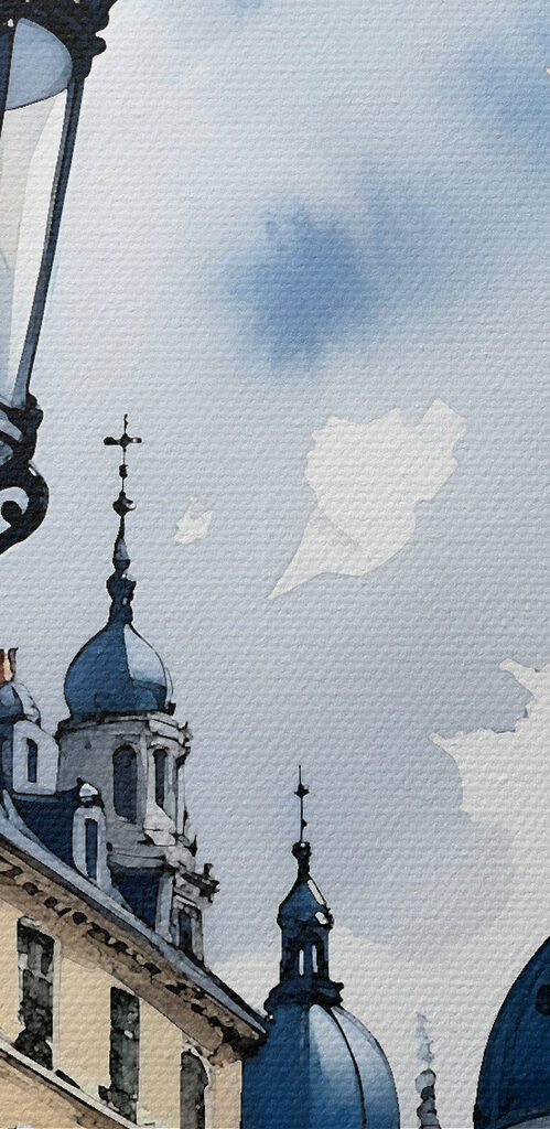 A street lamp with blue domes and buildings in the background