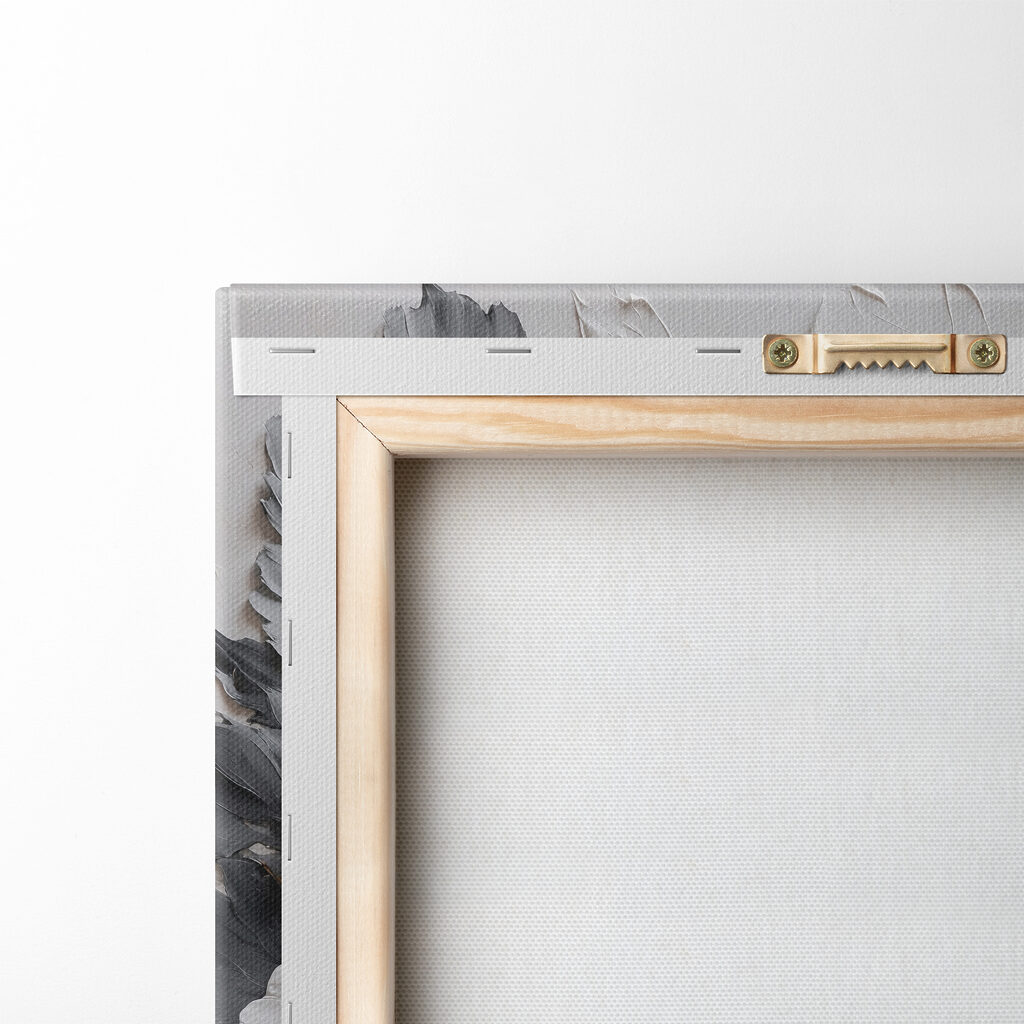 A white flower with black and grey leaves