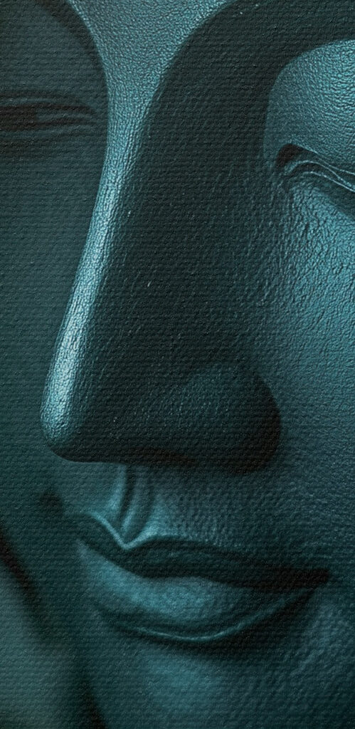 Statue of a person's face surrounded by leaves