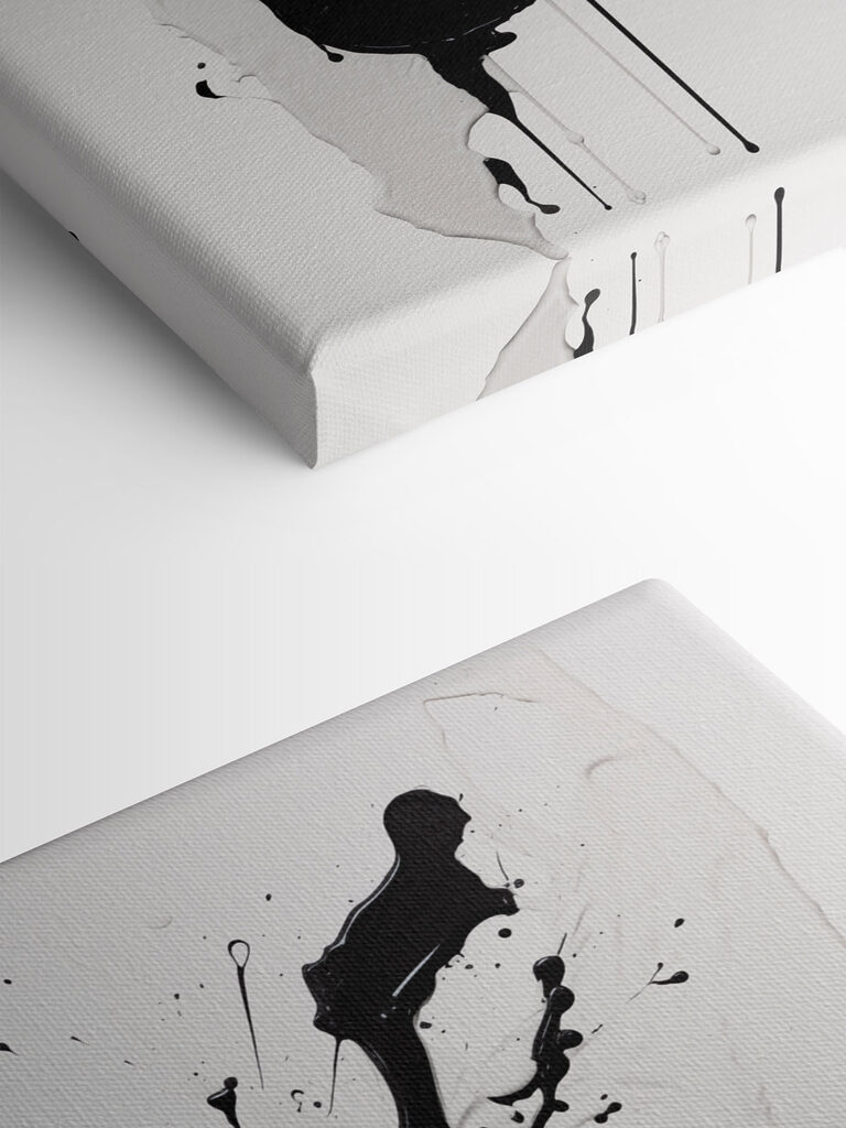 Black and white paint splattered on a white surface Black and white paint splattered on a white surface