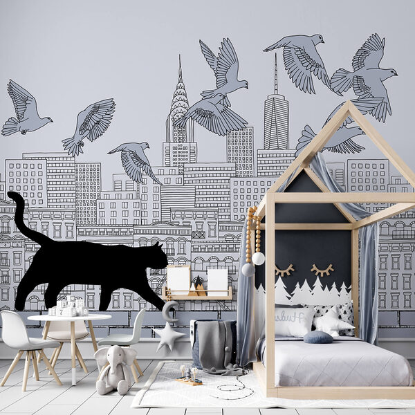 Katze, die auf einer Mauer läuft, während am Himmel Vögel fliegen Katze, die auf einer Mauer läuft, während am Himmel Vögel fliegen