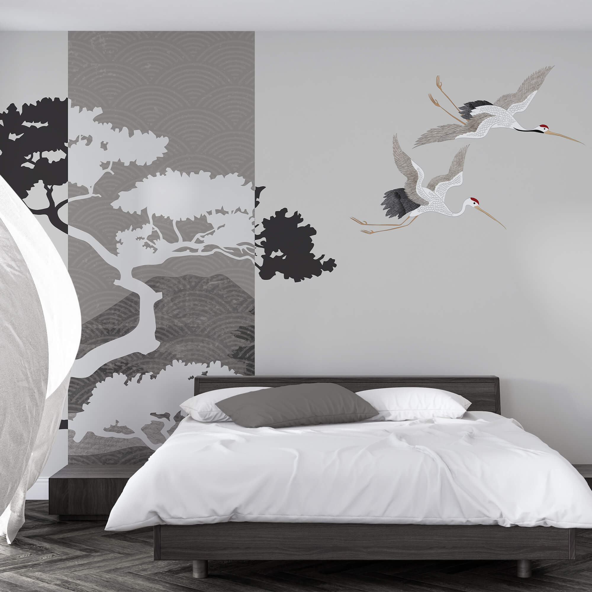 Ein paar Kraniche fliegen neben einem Baum