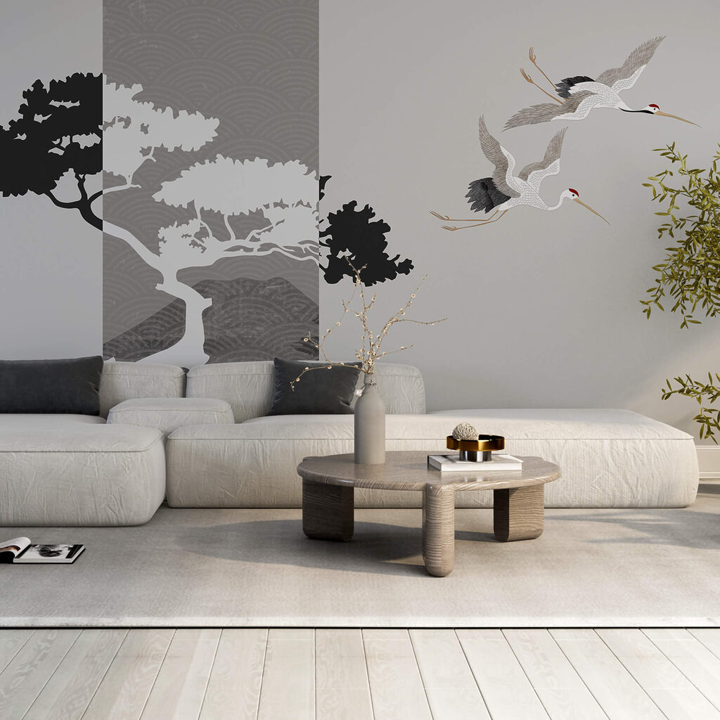 Ein paar Kraniche fliegen neben einem Baum