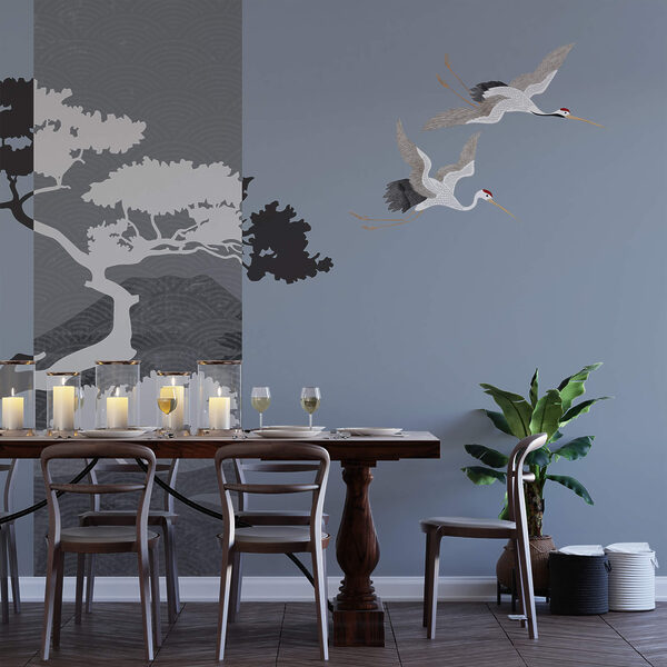 Ein paar Kraniche fliegen neben einem Baum Ein paar Kraniche fliegen neben einem Baum