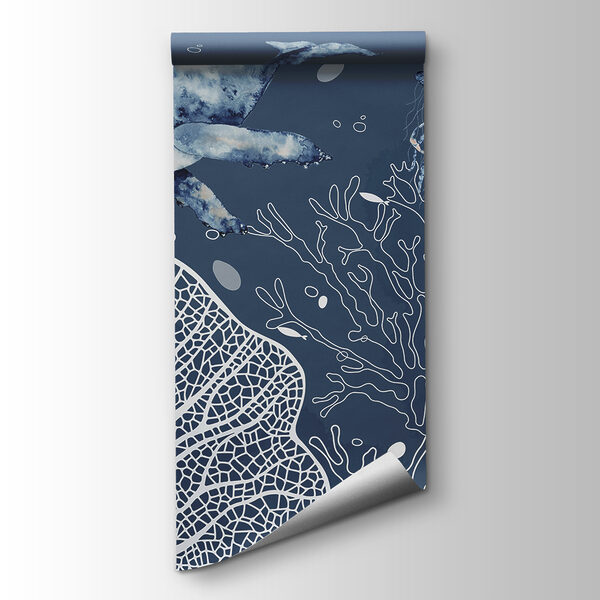 A whale and stingrays swimming in the ocean