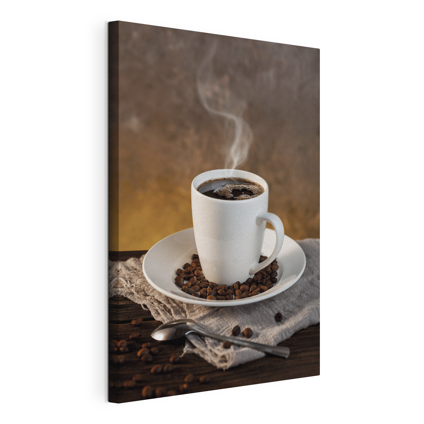 A cup of coffee on a plate with beans and a spoon