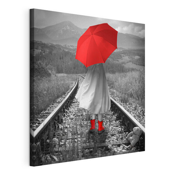 Wandbilder Eine Person mit einem roten Regenschirm auf einer Bahnstrecke