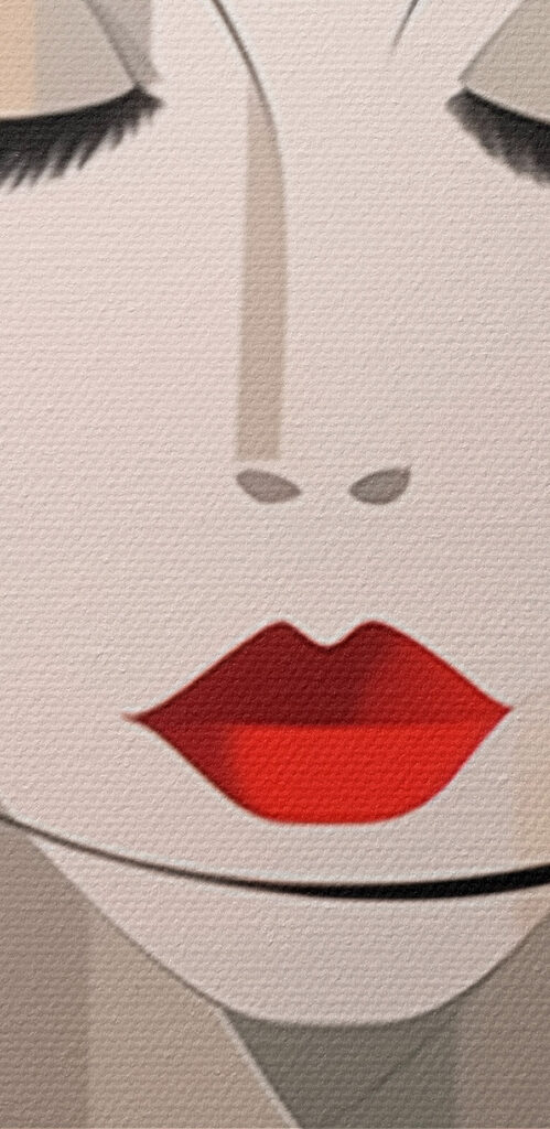 Woman's face with red lips and black hair