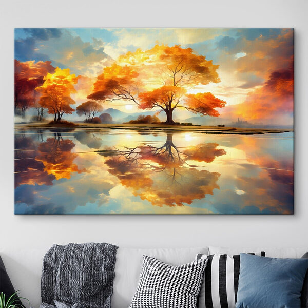 Tree with yellow leaves on the ground and a body of water