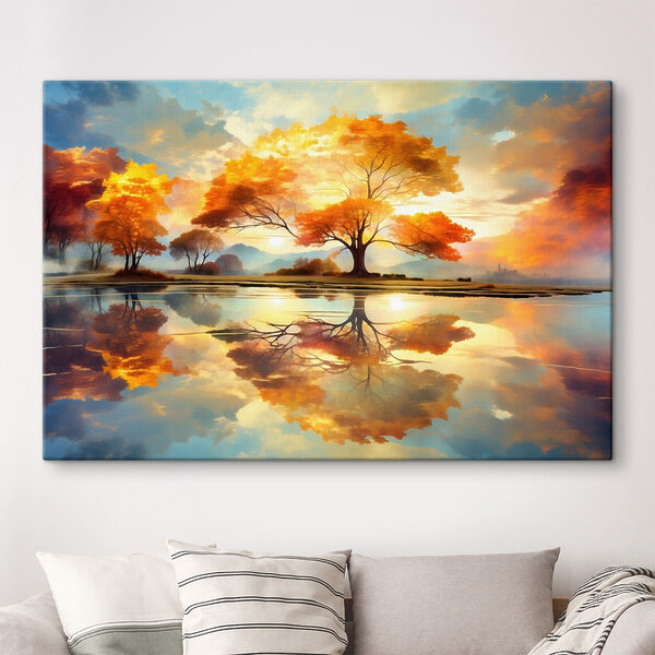Tree with yellow leaves on the ground and a body of water