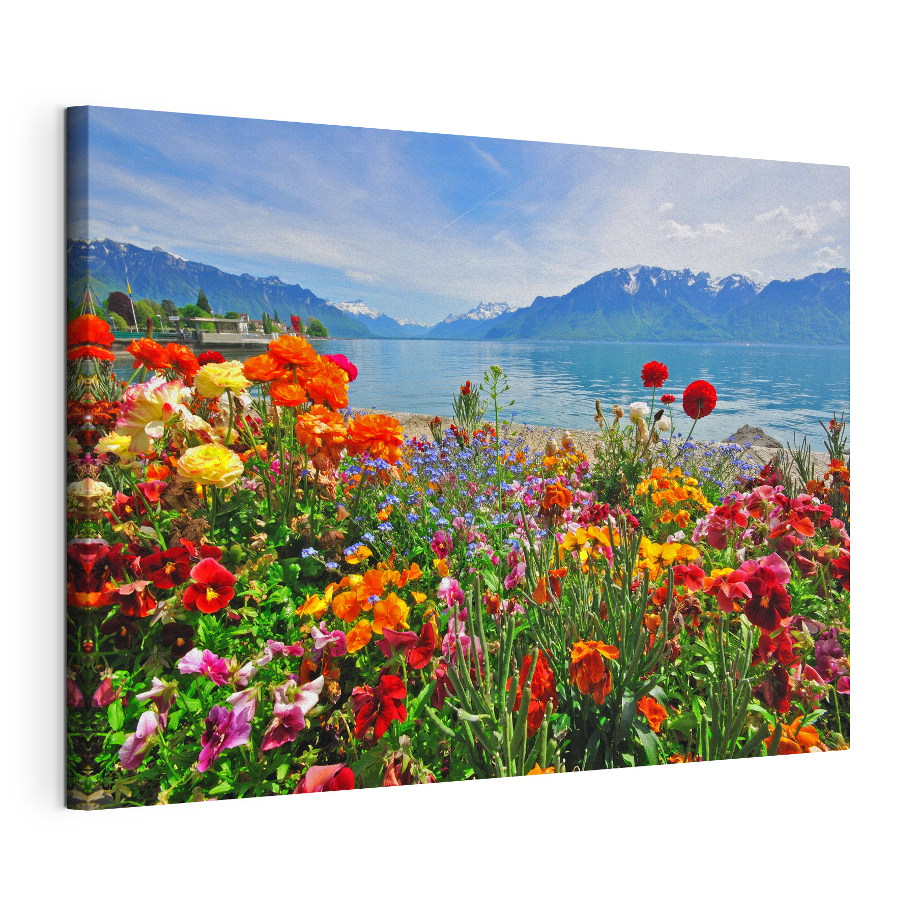 Flower bed with flowers and a lake in the background Flower bed with flowers and a lake in the background